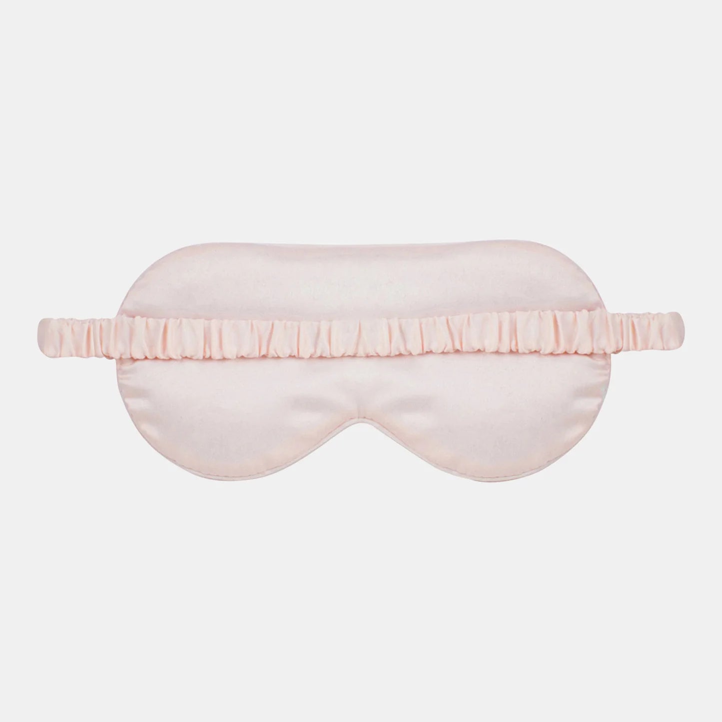 Pink sleep mask on a light gray background